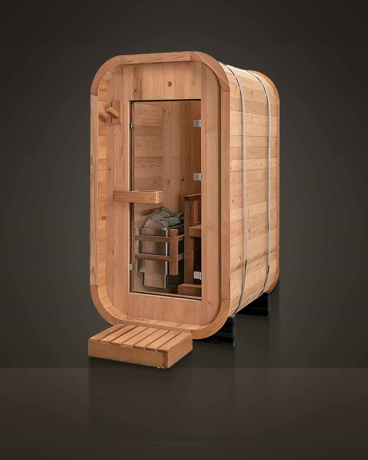 Cove 1: outdoor rounded sauna, red cedar with stainless steel bands. Full-height glass door.